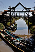 Inle Lake Myanmar. All the buildings are constructed on piles. Residents travel around by canoe, but there are also bamboo walkways and bridges over the canals, monasteries and stupas. 